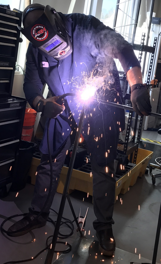 Welding custom laboratory hardware in the Goodwin Technologies shop.